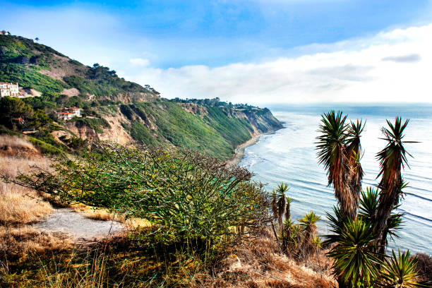 As the first light of day gently touches the coastline, Laguna Beach awakens in stillness and serenity. The waves roll in softly against the shore, the cliffs stand quietly under the morning sky, and the colors of dawn paint the landscape in warm pastels. It's a peaceful moment in a place that never ceases to feel like a living canvas—Laguna, timeless and beautiful, bathed in the calm of a new day.