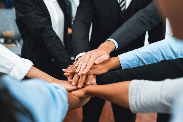 istock Multiracial business people make synergy hand stack together. Habiliment 2148150446