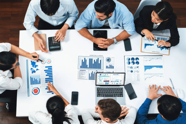 istock Analyst team utilizing BI Fintech to analyze financial data at table. Prudent 2148150523