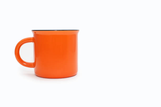 istock Orange mug on a white background with free space for text 2148151111