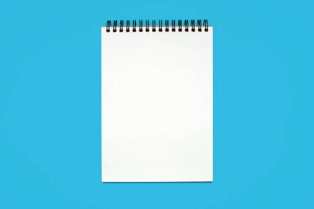 istock Notebook made of white paper with binding on a blue background 2148151190