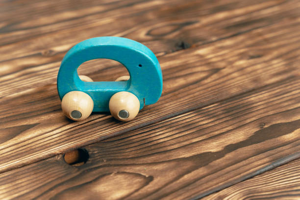 istock Wooden Toy Car on Table 2148151195