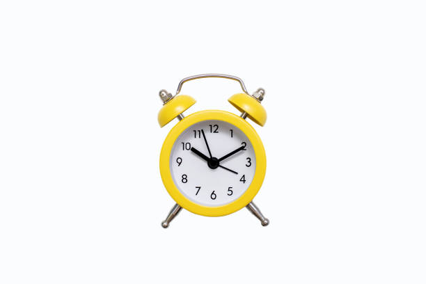 istock Yellow old-fashioned alarm clock with a dial on a white background with free space for text 2148151247