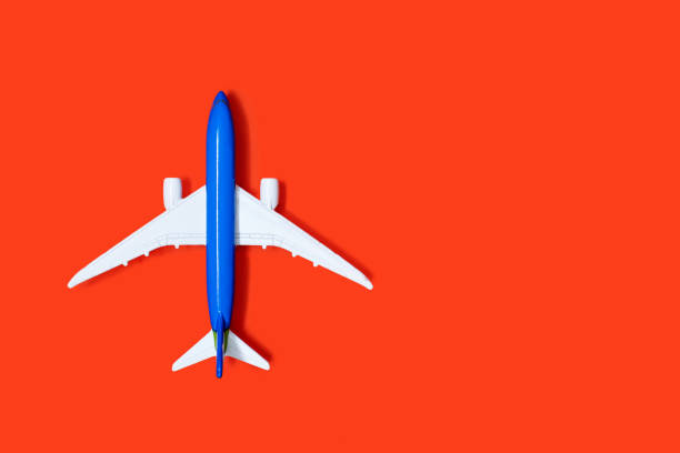 istock Aircraft model on an orange background with free space for text or advertising 2148151282