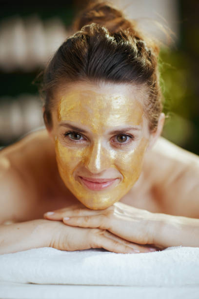 istock relaxed modern woman in massage cabinet laying on massage table 2148152330