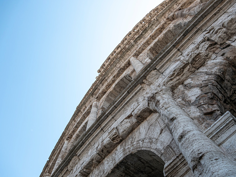 External view of the monumental three-story Colosseum in Rome. The Colosseum is the reference point for tourists visiting this wonderful city.