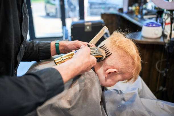 istock Little boy getting his first haircut. 2148153678