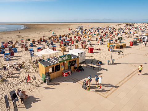 Promenade and west beach with people, chairs and tents on East Frisian island Borkum, Lower Saxony, Germany