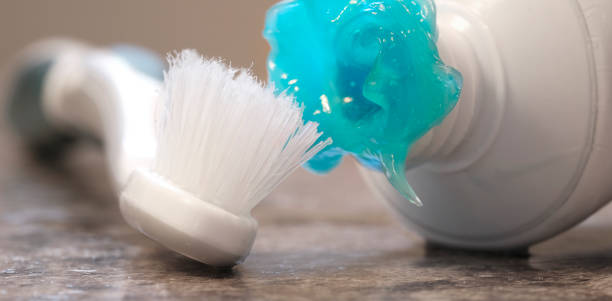 istock Worn Toothbrush and Messy Toothpaste Blue Gel for Brushing Teeth 2148157689
