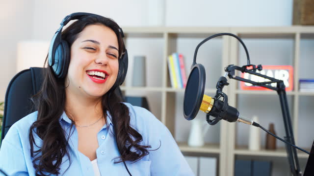 Portrait of Attractive Young Female Radio Host Hosting a Live Show