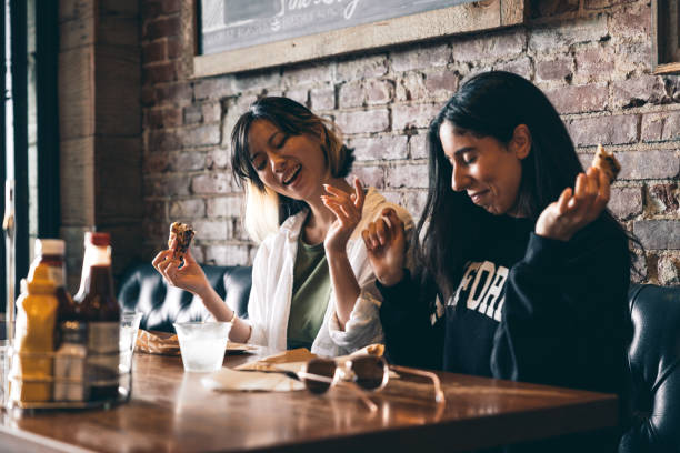 istock Friends eating in a restaurant 2148158971