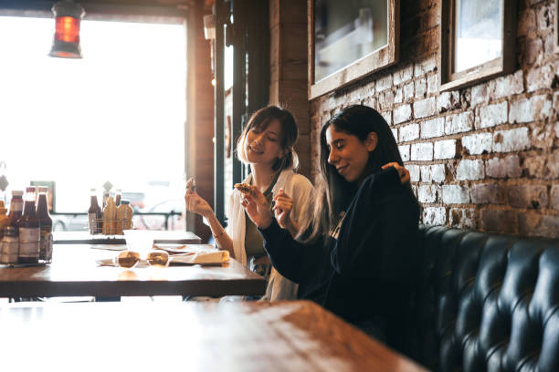 istock Friends eating in a restaurant 2148159092