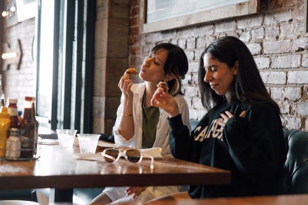istock Friends eating in a restaurant 2148159171