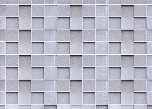 Geometric square pattern background of blank expanded aluminum grating decoration on exterior building wall in modern style