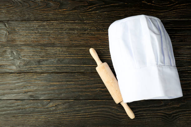 Concept of cooking food with chef hat, space for text