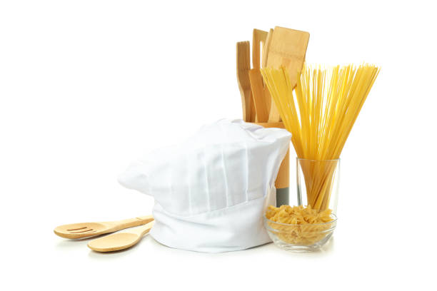 Composition with chef hat for concept of cooking, isolated on white background