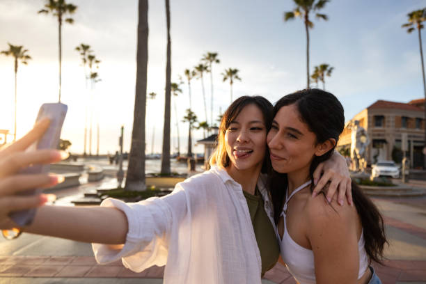 istock Happy women on summer vacation and shoot a selfie 2148160772