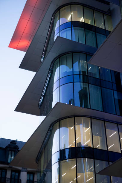 istock Illuminated modern office building exterior at twilight 2148160791