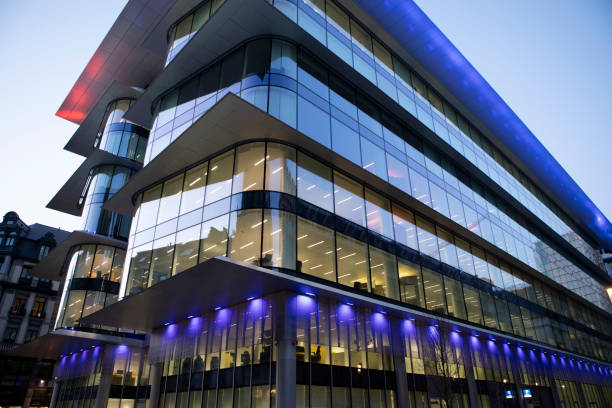 istock Illuminated modern office building exterior at twilight 2148161154