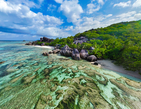 Clouds over world famous Anse Source d'Argent beach. La Digue island, Seychelles