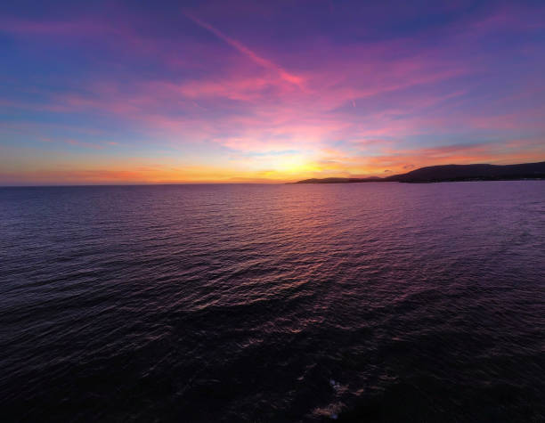 Pink sunset at the sea in Sardinia, Italy