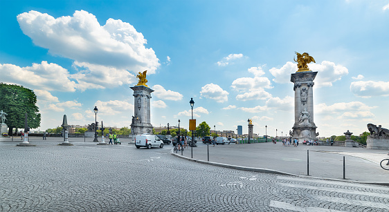 Paris, FR - July 06 2018: Columns at the end of Alexander III bridge
