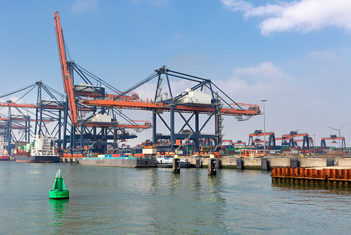 Large gantry cranes and container ship - port of Rotterdam - Maasvlakte