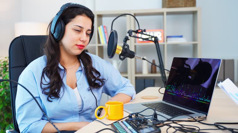 Portrait of Attractive Young Female Radio Host Hosting a Live Show