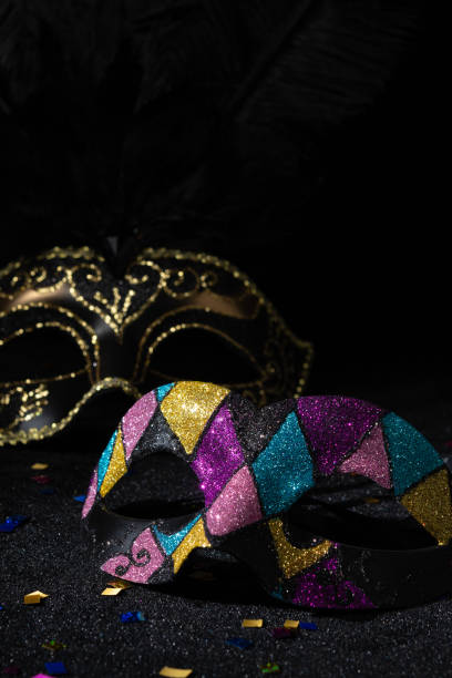 istock Venetian Masquerade masks on black background. Carnival party layout. 2148166887