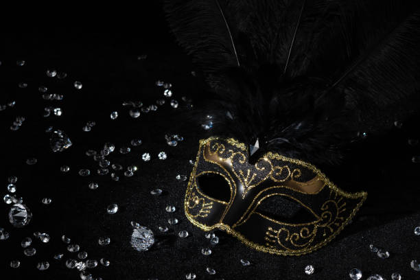 istock Masquerade gold mask with gemstones on black background. 2148166906