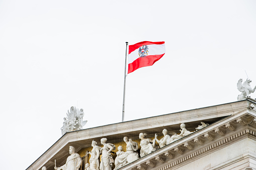 The Austrian flag on the parliament building in Vienna