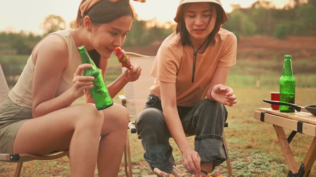 young pretty Asian woman  enjoy camping