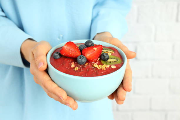 istock Woman holds smoothie with different ingredients, close up 2148168649