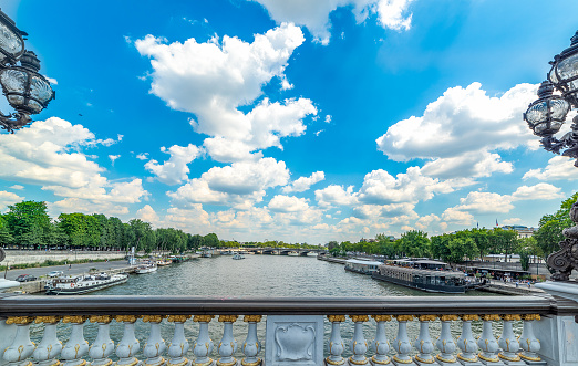 Clouds over Alexander III bridge in Paris, France