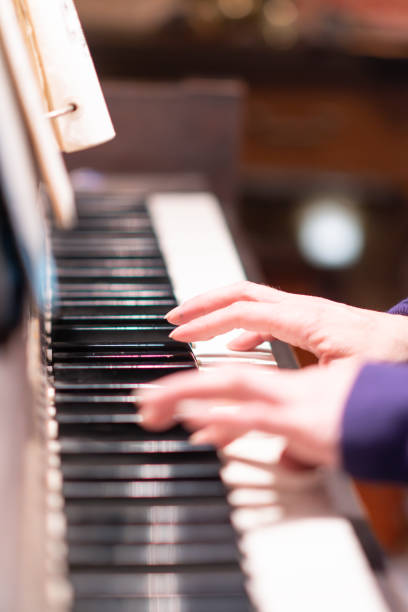 istock fingers close up playing piano music copy space background 2148170713