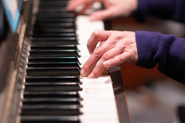 istock fingers close up playing piano music copy space background 2148170769
