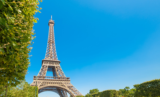 World famous Eiffel tower under a blue sky. Paris, France
