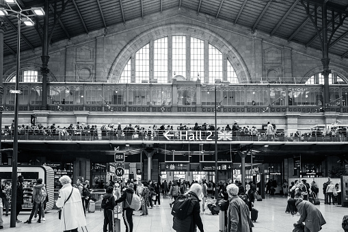 Paris, France - April 6th, 2024: Train station entrance at Gare du Nord with passengers in Paris, France