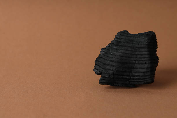Natural wood or hardwood charcoal, space for text