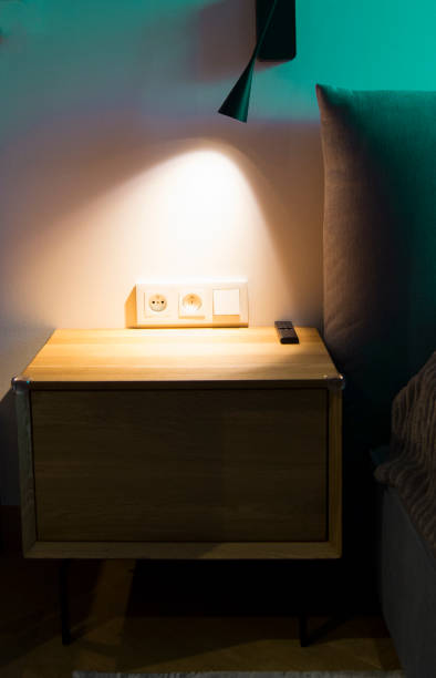 istock Nightstand. Bedroom. Soft yellow night light. 2148172978