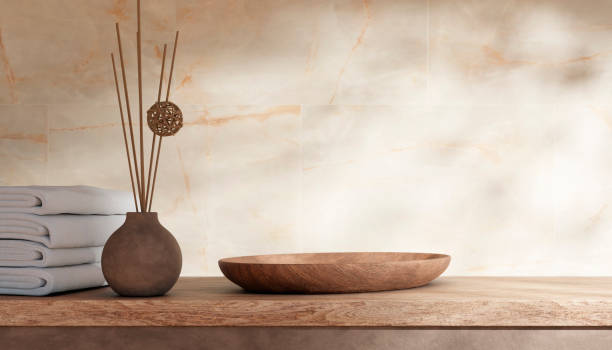 istock Empty bathroom counter top with beige granite walls and sunlight. 2148174240