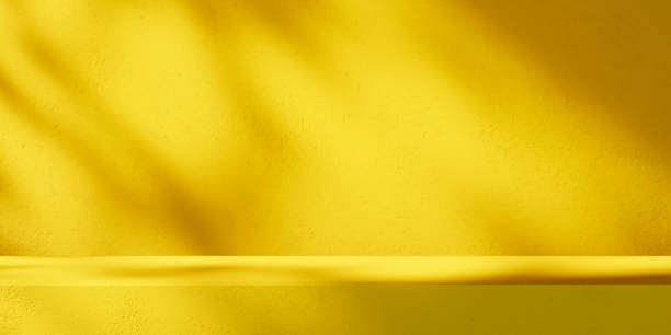 istock Yellow background podium stage for luxury product placement mockup. 2148174243