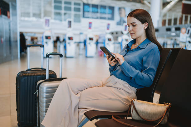 istock A woman at the airport using smartphone 2148174425