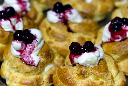 cream puffs with Chantilly cream and blueberries. HQ photo