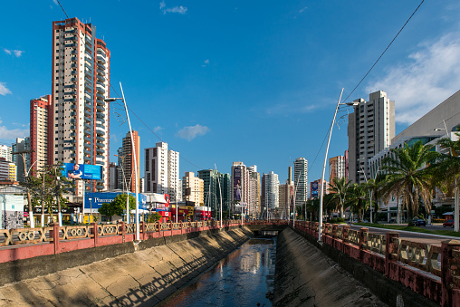 Belem, Brazil - December 25, 2023; Canal along the Visconde de Souza Franco Avenue with tall modern residential buildings around.