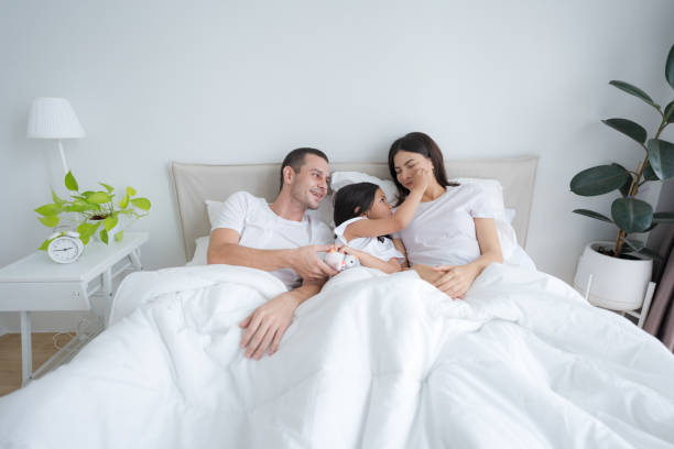 istock Lovely parents and daughter happy smiling faces. 2148177180