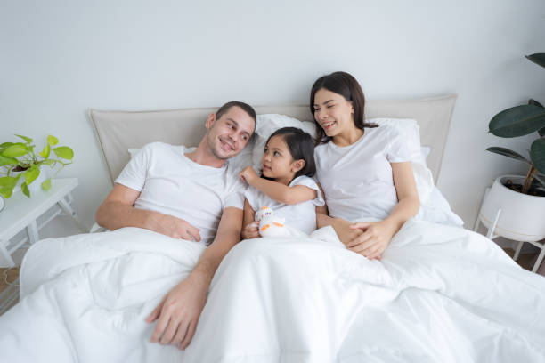 istock Lovely parents and daughter happy smiling faces. 2148177293