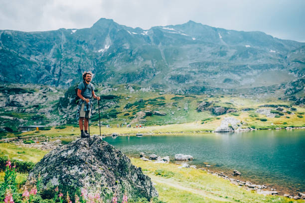 Tourist on the mountain top looking at view