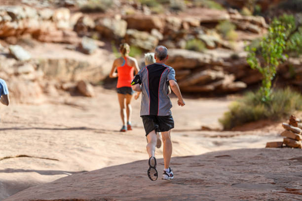 istock Active senior man trail runs outside in Utah 2148178071
