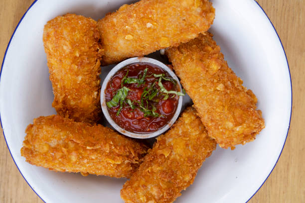 istock Top view of gourmet mozzarella sticks with a dipping sauce 2148183694